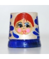 Silver doll with a blue flower