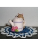 Cat with a watering pot