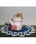 Cat with a watering pot