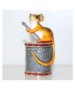 Mouse sitting on a spool