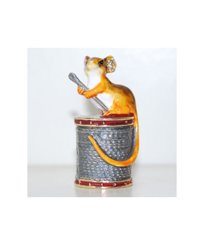 Mouse sitting on a spool