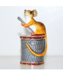 Mouse sitting on a spool