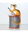 Mouse sitting on a spool